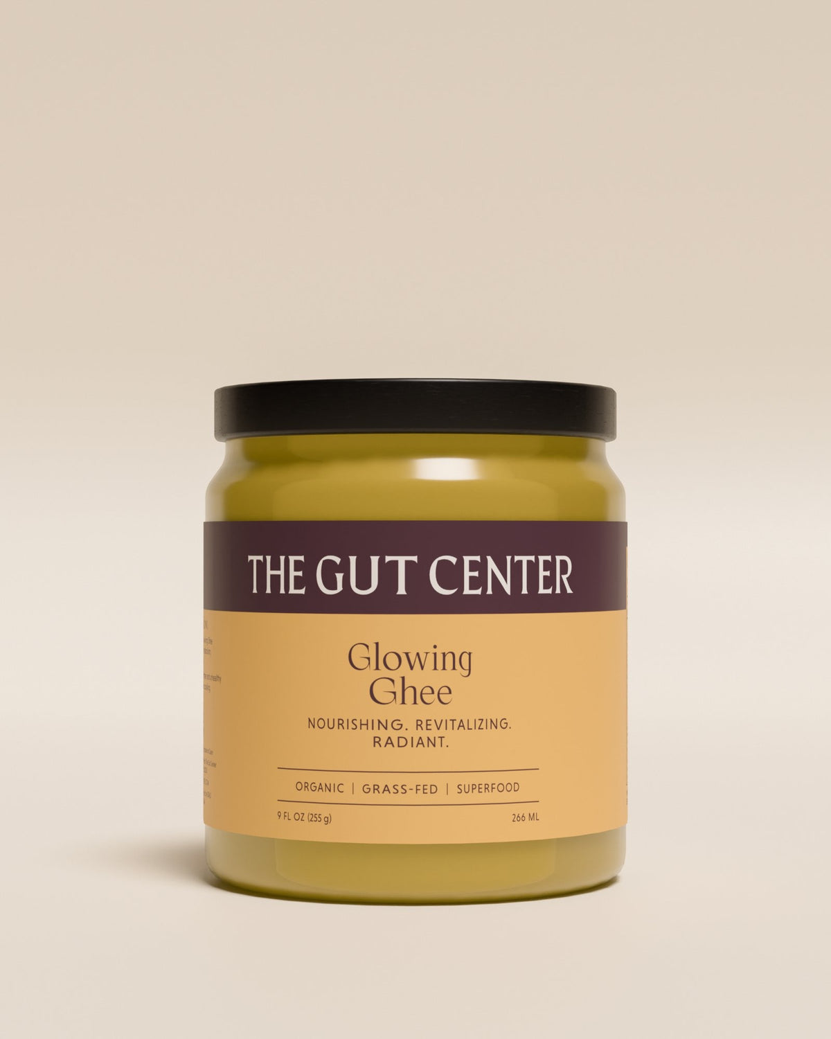 Glowing Ghee jar from The Gut Center, front label: nourishing, revitalizing, radiant; organic, grass-fed superfood.