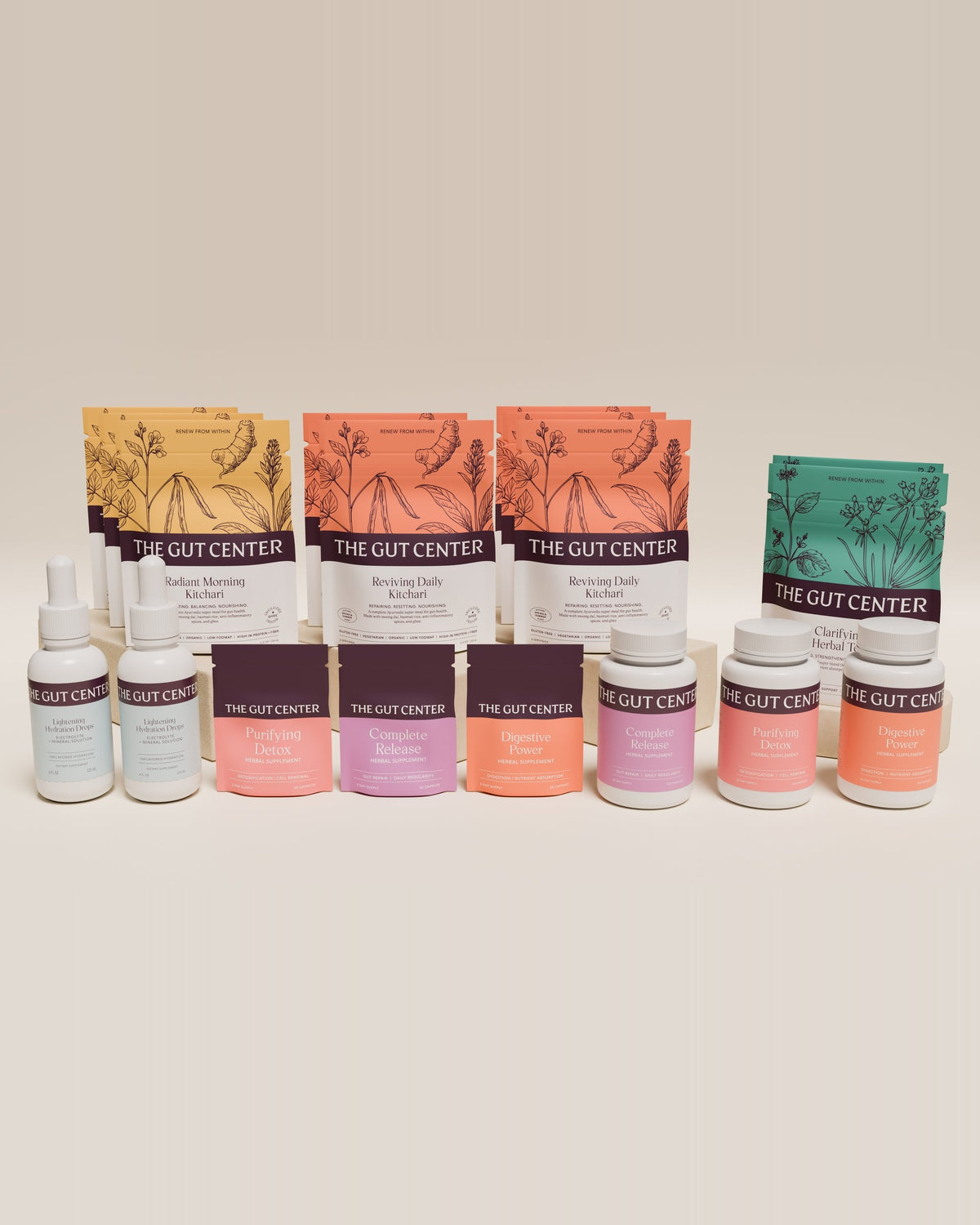 Renew Extended cleanse set with kitchari pouches, Clarifying Herbal Tea, two Lightening Hydration Drops bottles, and Purifying Detox, Complete Release and Digestive Power pouches and bottles.