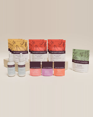 Renew Advanced cleanse set with Grounding Herbal Tea: Radiant Morning and Reviving Daily Kitchari pouches, two Lightening Hydration Drops bottles and the three herbal supplement pouches.