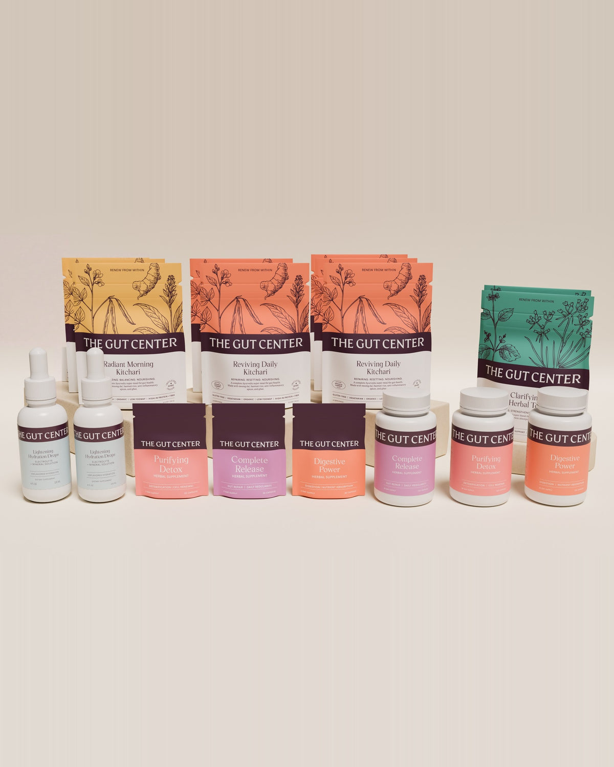 Renew Extended cleanse set: Radiant Morning and Reviving Daily Kitchari pouches, Clarifying Herbal Tea, two Lightening Hydration Drops bottles, the three herbal supplement pouches and three supplement bottles.