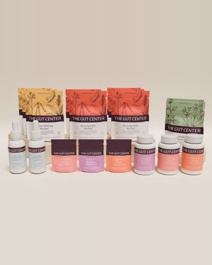 Renew Extended cleanse set with Grounding Herbal Tea, kitchari pouches, two Lightening Hydration Drops bottles, and the three herbal supplements in pouches and bottles.