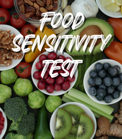 Food Sensitivity Test title card over an overhead spread of vegetables, fruit, nuts and herbs.