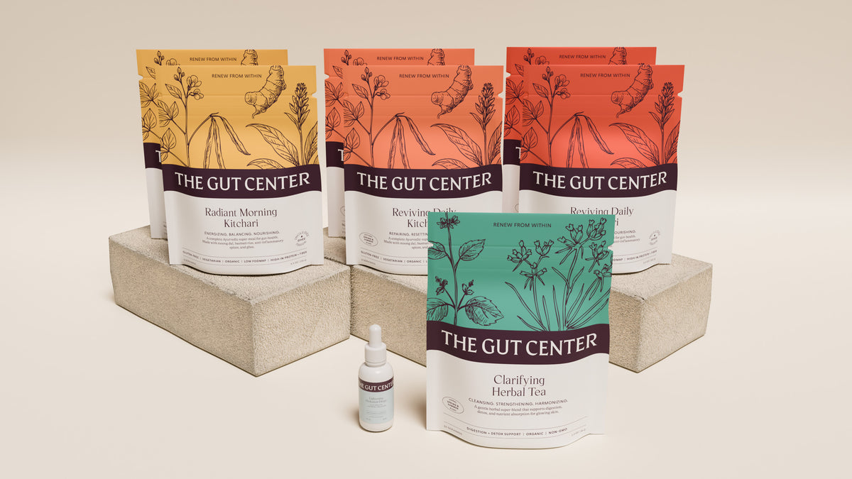Renew Core set on a plaster block: Radiant Morning and Reviving Daily Kitchari pouches, Clarifying Herbal Tea and a Lightening Hydration Drops bottle.